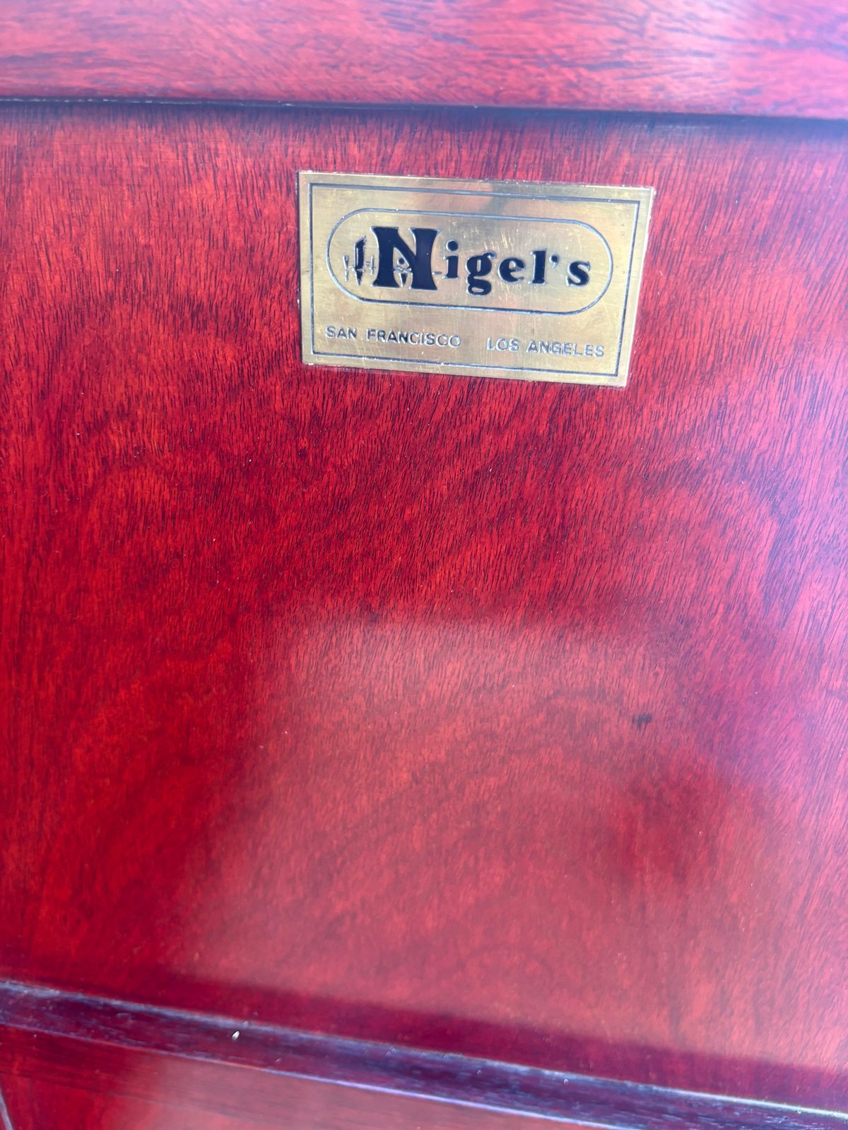 Vintage red Tigers luggage or travel case with cream-colored label showing San Francisco and Los Angeles branding